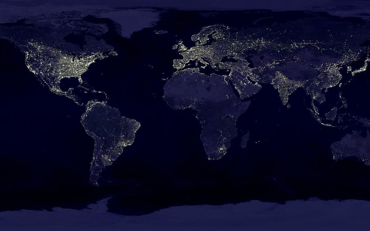 Earth at night seen from space, city lights marking where people live