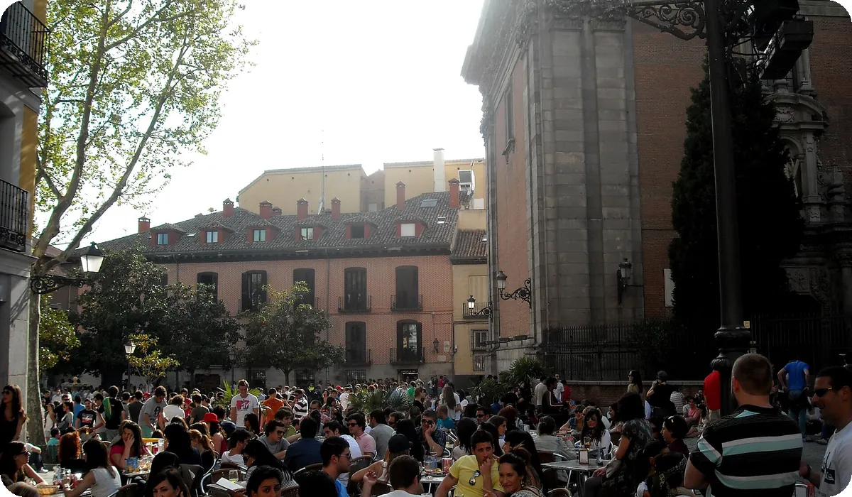 Crowded terraces in La Latina, Madrid, full of people chatting at natural speed